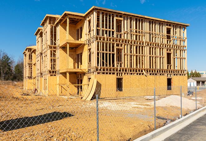 a close-up of temporary chain link fences enclosing a job site, signaling progress in the project's development in Freemansburg, PA